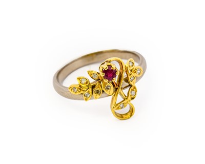 Lot 1080 - An 18 carat gold ruby and diamond ring, the...