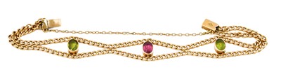 Lot 1041 - A peridot and pink tourmaline bracelet, the...