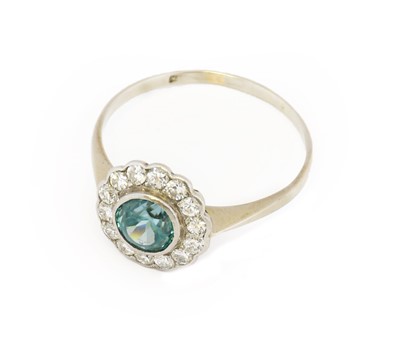 Lot 1082 - A blue zircon and diamond cluster ring, the...