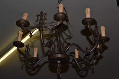 Lot 1424 - A pair of six-light chandeliers, hammered...