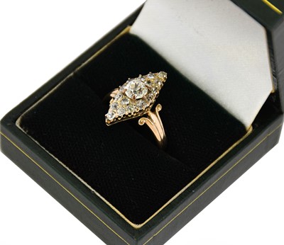Lot 1114 - A diamond cluster ring, the navette form set...