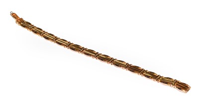 Lot 70 - A gate link bracelet, stamped '9CT', length 18....