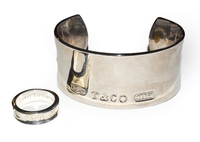 Lot 73 - A Tiffany & Co. bangle; together with a...