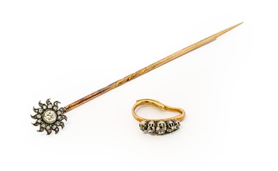 Lot 1086 - A diamond sunburst stick pin, the cluster...