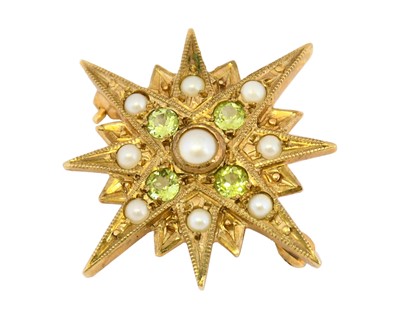 Lot 1096 - A peridot and split pearl star brooch, a split...