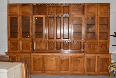 Lot 1289 - A large fitted oak sectional wall unit
