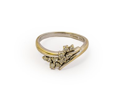 Lot 1009 - An 18 carat white gold diamond ring, the spray...