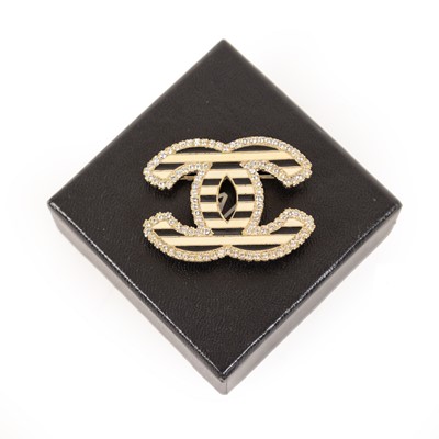 Lot 3009 - An Enamel and Paste Brooch, by Chanel, two...