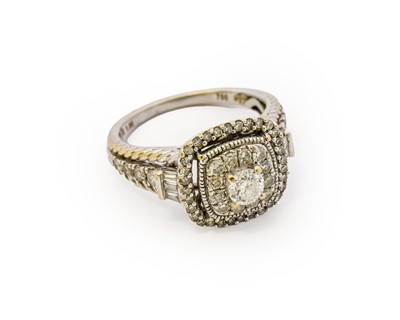 Lot 1091 - A diamond cluster ring, the central round...