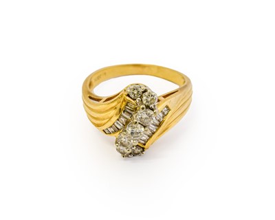 Lot 1011 - A diamond cluster ring, the central S-shaped...