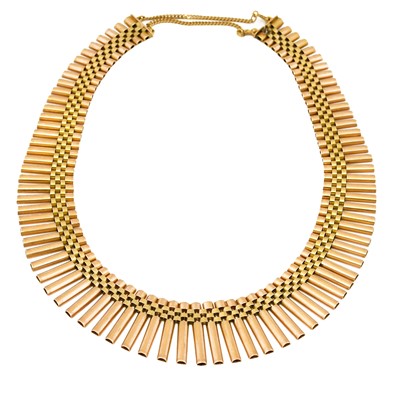 Lot 1035 - A fancy link necklace, the graduated yellow...
