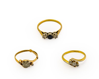 Lot 1003 - An 18 carat gold sapphire and diamond three...