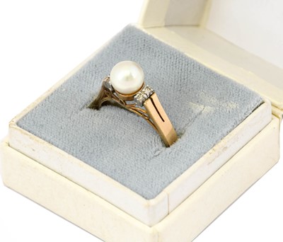 Lot 1108 - A cultured pearl and diamond ring, the...
