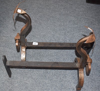 Lot 327 - A pair of polished steel andirons with flower...