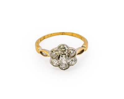 Lot 1014 - A diamond cluster ring, the central raised...