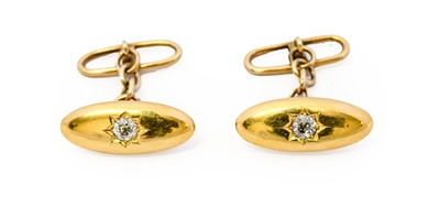 Lot 1046 - A pair of diamond cufflinks, the yellow plain...
