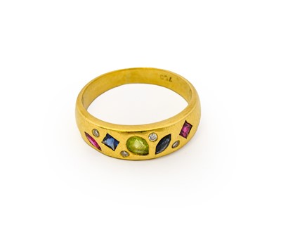 Lot 1039 - A synthetic ruby, synthetic sapphire, peridot...