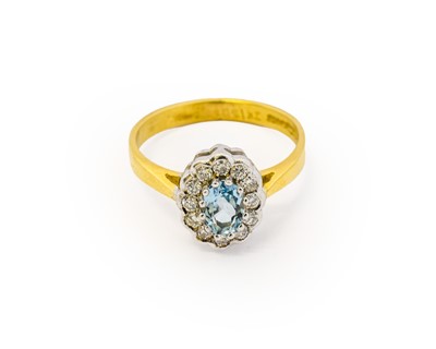 Lot 1010 - An 18 carat gold aquamarine and diamond...