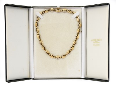 Lot 1083 - A 9 carat gold fancy link necklace, the twenty-...