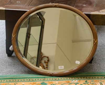 Lot 1294 - A reeded and gilt-framed oval mirror 65cm by 56cm