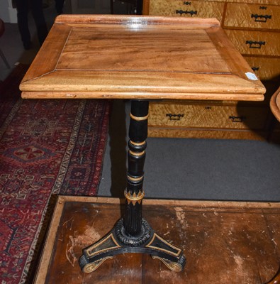 Lot 1334 - A Regency reading stand on ebonized and gilt...
