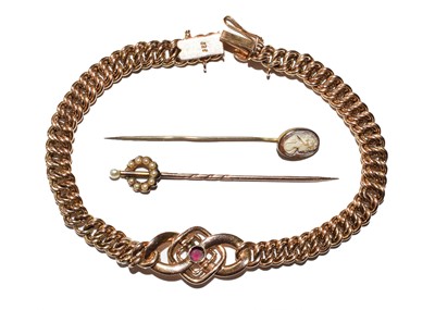 Lot 123 - A cameo stick pin; a split pearl stick pin;...