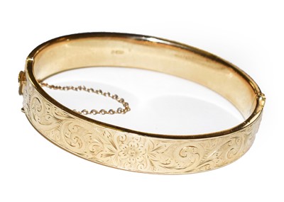 Lot 89 - A 9 carat gold hinged bangle, inner...