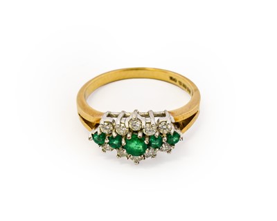 Lot 1007 - A 9 carat gold emerald and diamond cluster...