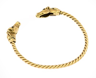 Lot 1022 - A 9 carat gold torque bangle, by Harriet Glen,...