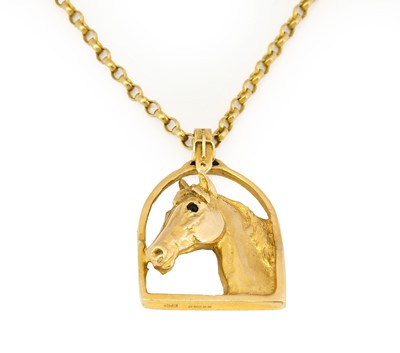 Lot 1074 - A 9 carat gold horse pendant on chain, by...