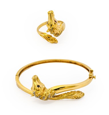 Lot 1015 - A diamond and sapphire horse hinged bangle,...