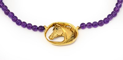Lot 1016 - A 9 carat gold amethyst and sapphire necklace,...