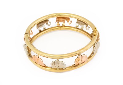 Lot 1023 - An elephant hinged bangle, white, rose and...
