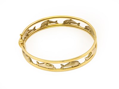 Lot 1021 - A dolphin hinged bangle, four yellow textured...