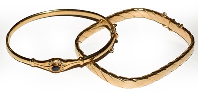 Lot 75 - A sapphire and diamond hinged bangle, stamped '...