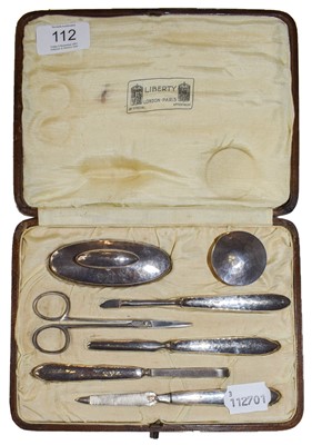 Lot 112 - A Liberty silver manicure set, Birmingham 1919,...