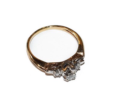 Lot 132 - A diamond three stone ring, unmarked, finger...