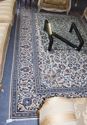 Lot 1210 - Kashan carpet, the ivory field of vines...