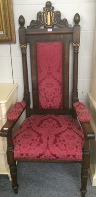 Lot 1157 - A 1920s carved and parcel-gilt oak chair in...