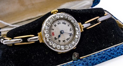 Lot 1125 - A lady's 18 carat gold diamond wristwatch,...