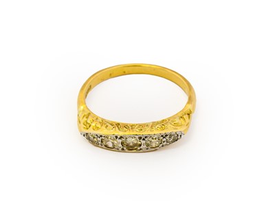 Lot 1060 - An 18 carat gold diamond five stone ring, the...