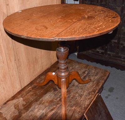 Lot 1390 - A George III oak tilt-top tripod table