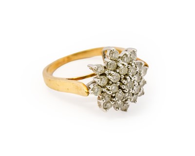 Lot 1121 - A 9 carat gold diamond cluster ring, the...