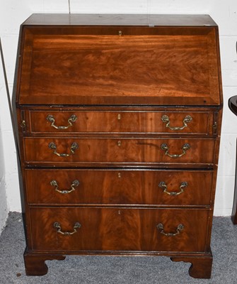 Lot 1253 - A George III style crossbanded mahogany bureau...