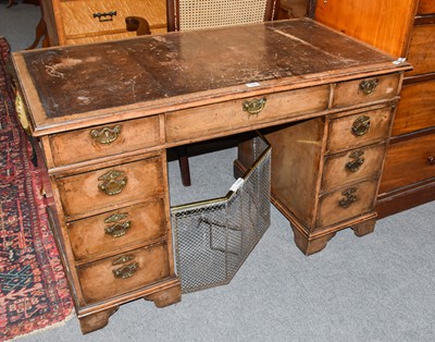 Lot 1329 - A George II style walnut twin pedestal desk,...