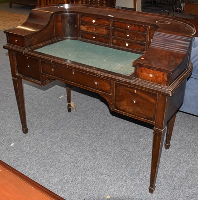 Lot 1275 - A George III style mahogany Carlton House desk,...