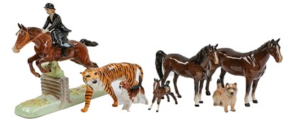 Lot 187 - Beswick Huntswoman (Style One - Rider and Horse Jumping)