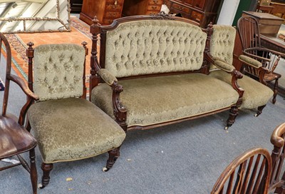 Lot 1352 - A Victorian carved mahogany button backed sofa...