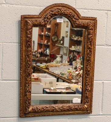 Lot 1423 - A composition gilt framed wall mirror