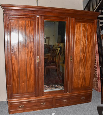 Lot 1285 - An early 20th-century wardrobe with central...